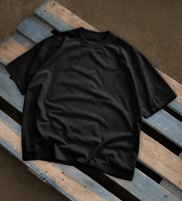 Oversized Black t-shirt lying on a desk